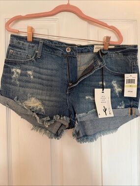 Pistola Medium Blue Distressed Denim Cutoff Shorts in nostalgia